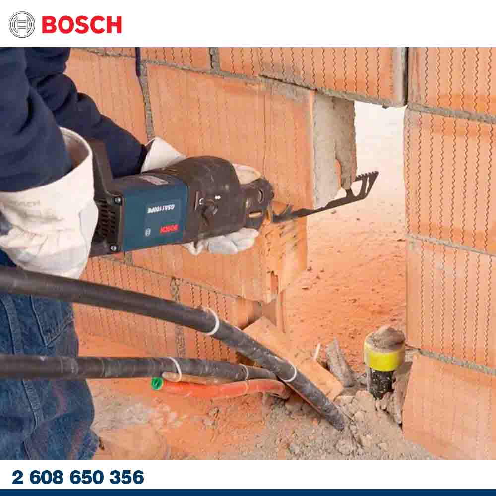 Person using a Bosch power tool on a brick wall with visible branding.