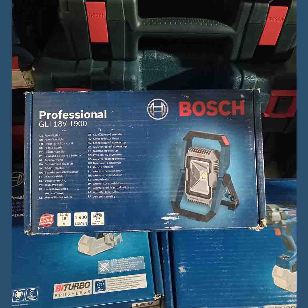 Bosch professional GLI 18V-1900 tool box on a shelf with other tools in the background.