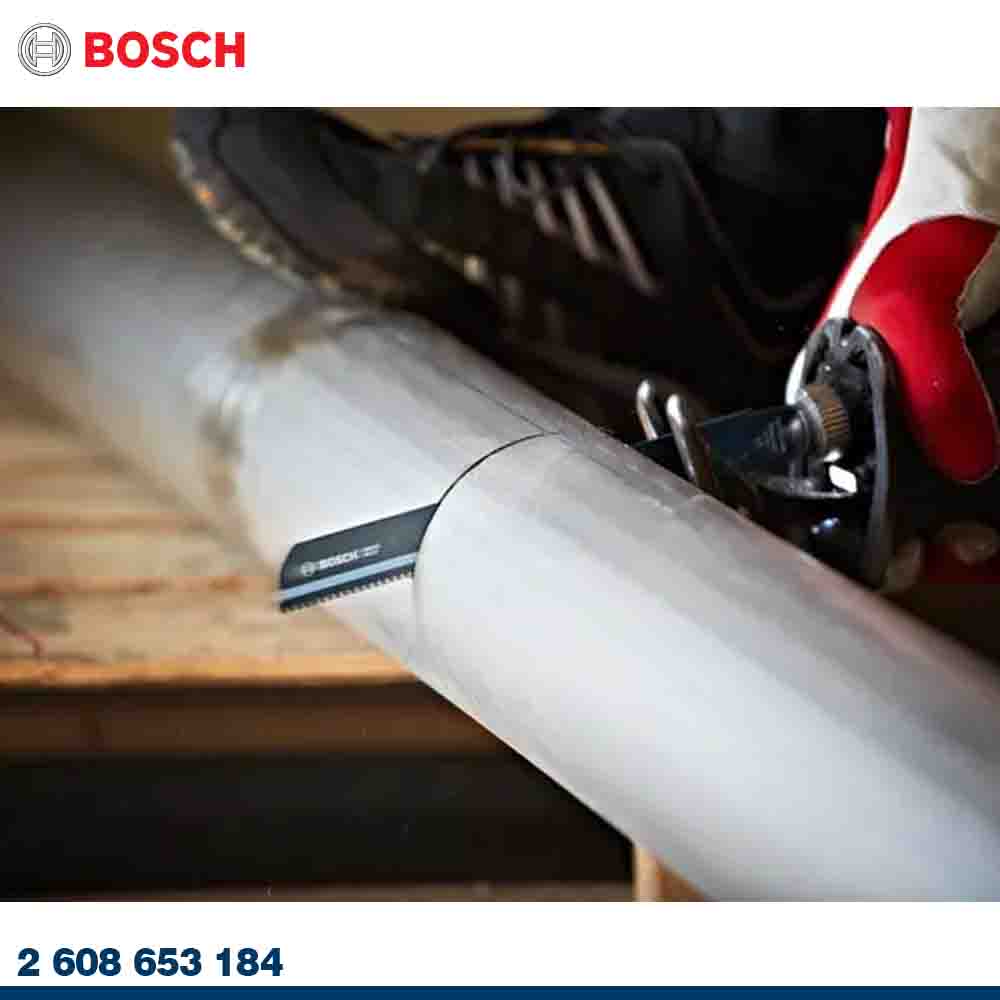 Bosch tool being used on a metal pipe with a glove on, on a blurred background.