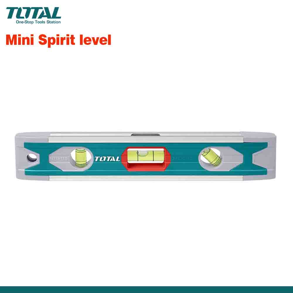 A compact spirit level with a green body, black detailing, and the brand name 'TOTAL' displayed prominently. It has three vials for measuring levels at different angles.