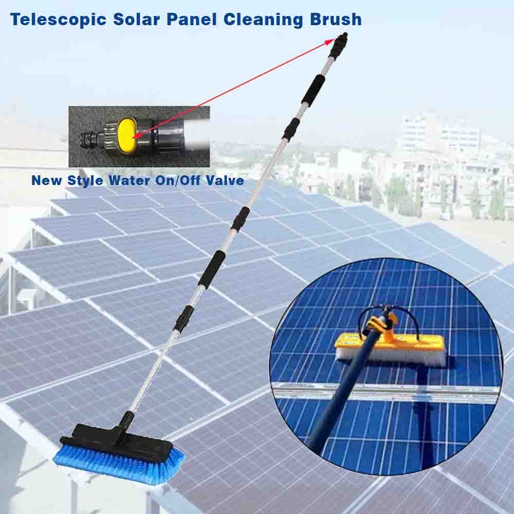 Telescopic solar panel cleaning brush with water on/off valve on a solar panel