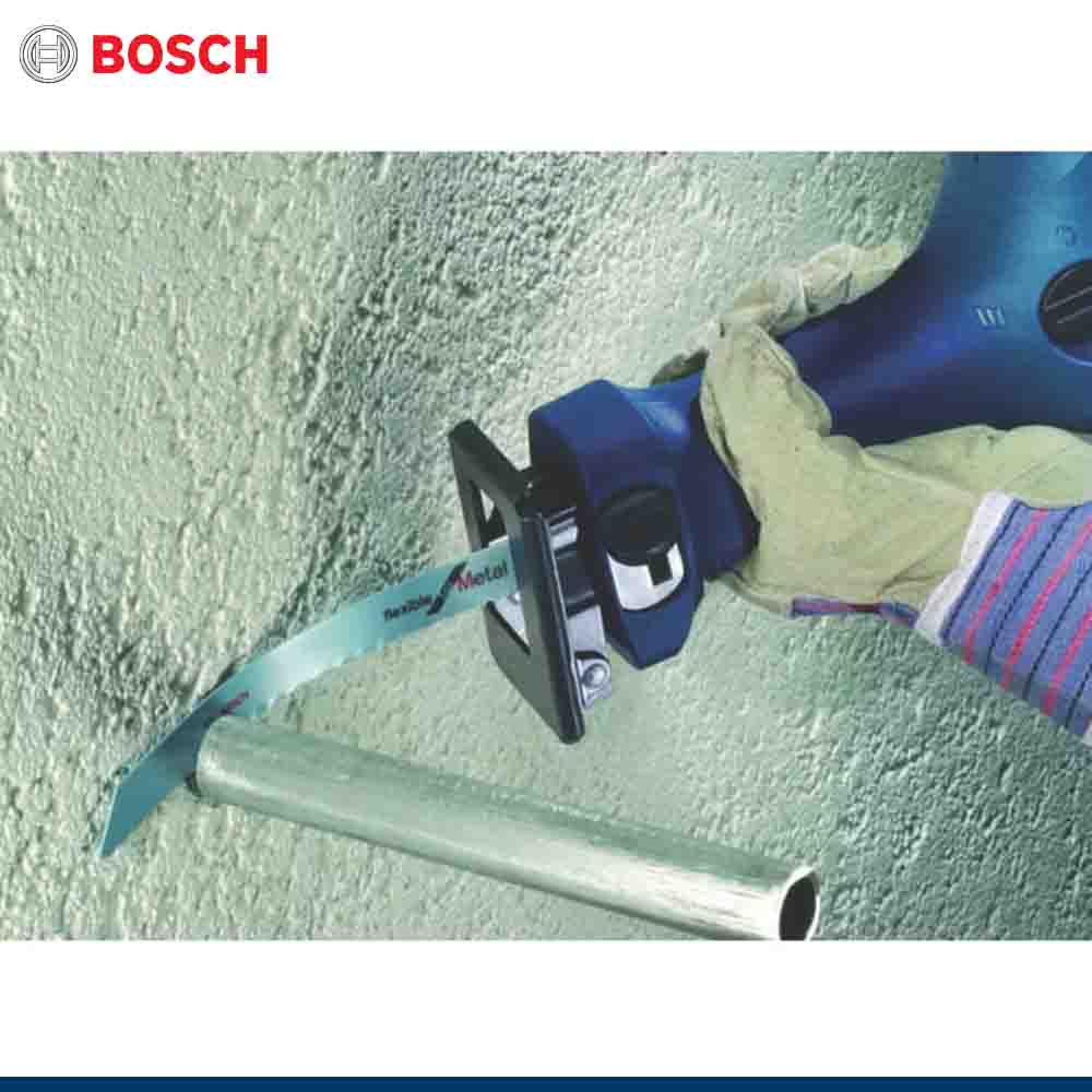 Bosch power tool cutting metal pipe with a gloved hand, on a light green background.